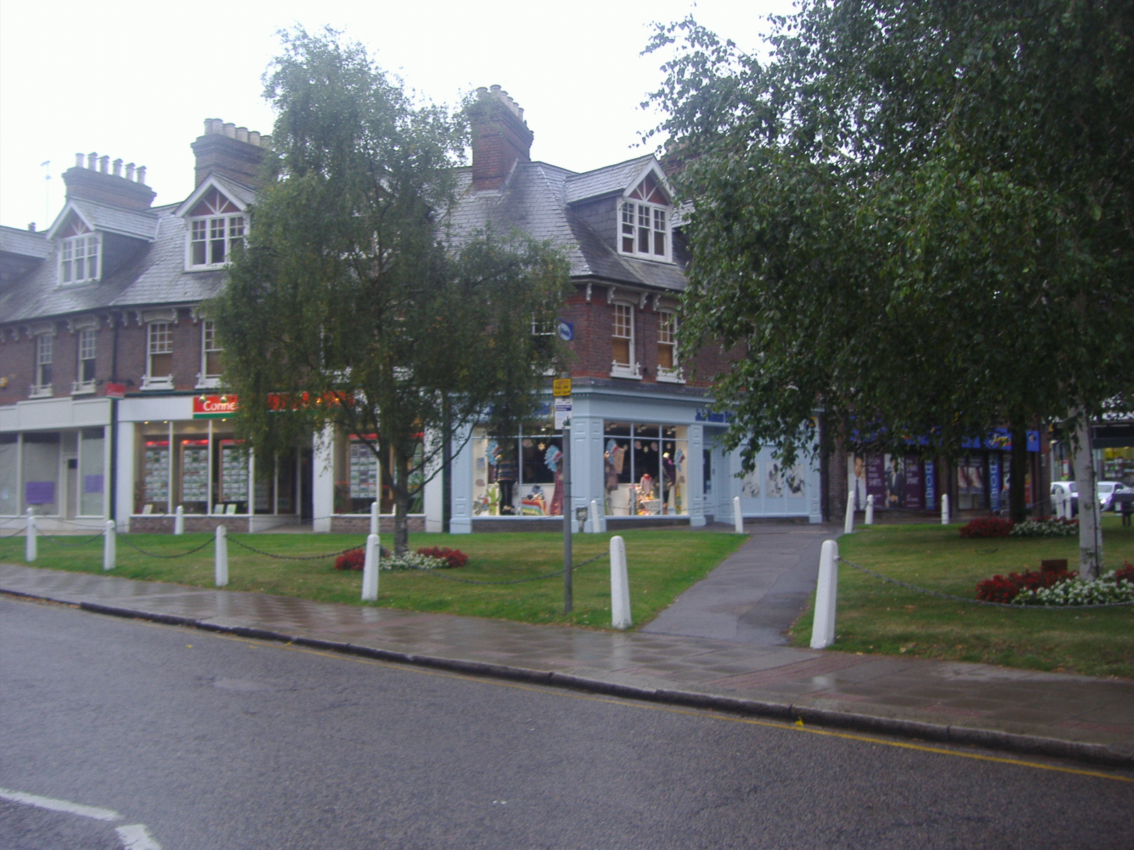 Shops on Harpenden High Street, the town centre that will remain part of a new, larger local authority from 2028.